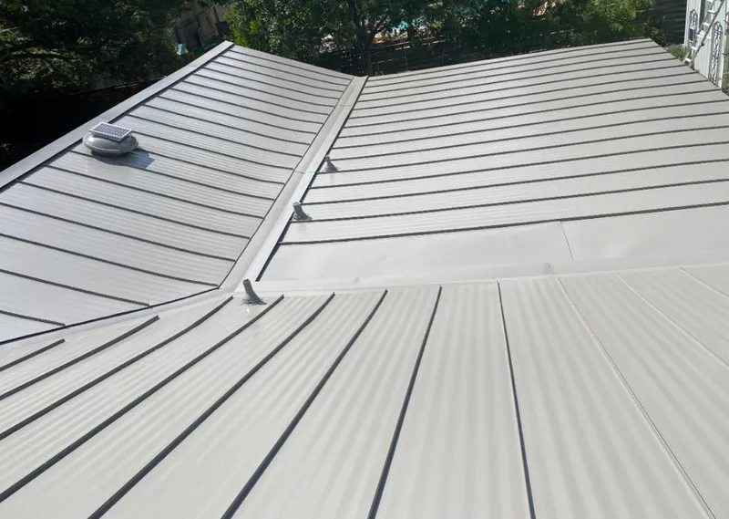 Solar attic fan installed on a metal roof for Roof Ventilation in Helena Valley Northwest